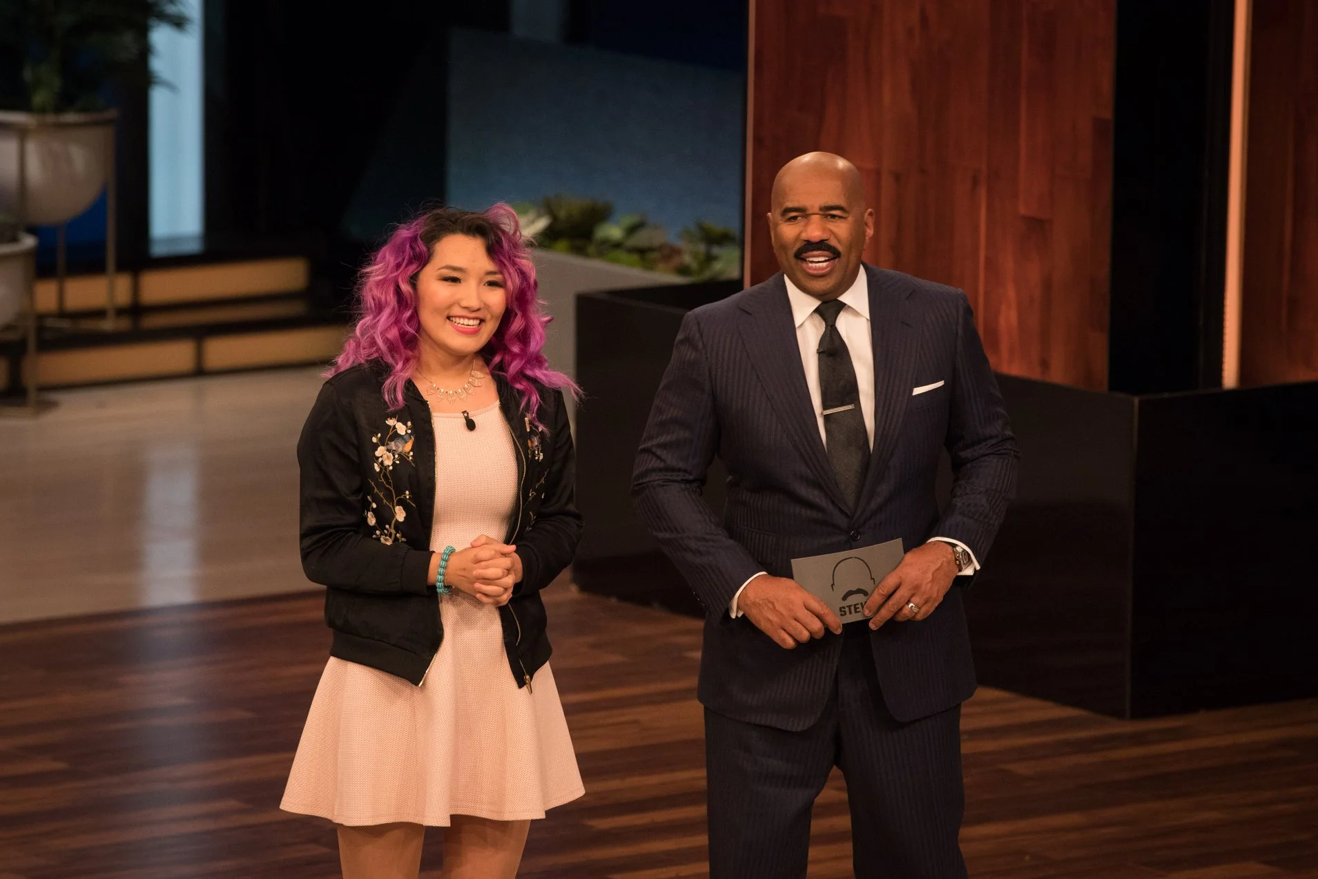Yanjaa Westgate on stage with Steve Harvey